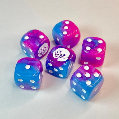 six dice coloured pink and blue with a pearly tie-die effect, featuring a beetle character on the sixth face
